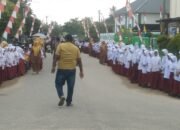 Sambut Hangat Maulid Nabi, Ratusan Murid SDN 3 dan SDN 4 Aceh Timur Pagar Betis Tunggu Kedatangan Bupati